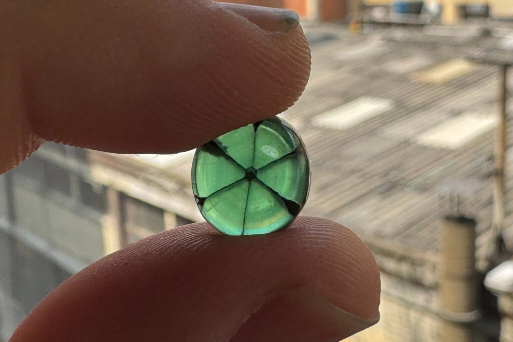 Trapiche colombian emerald showing six-ray star pattern and vivid green color